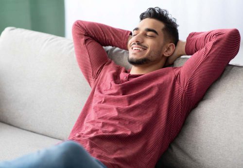 Man sits on couch with therapist using Dialectical Behavioral Therapy