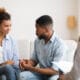Couple holding hands in emotionally focused therapy session