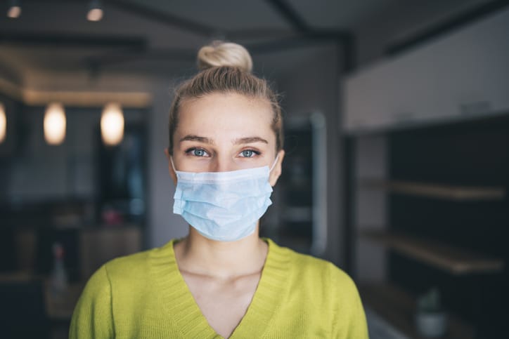 Woman with face mask reentering a post-pandemic world