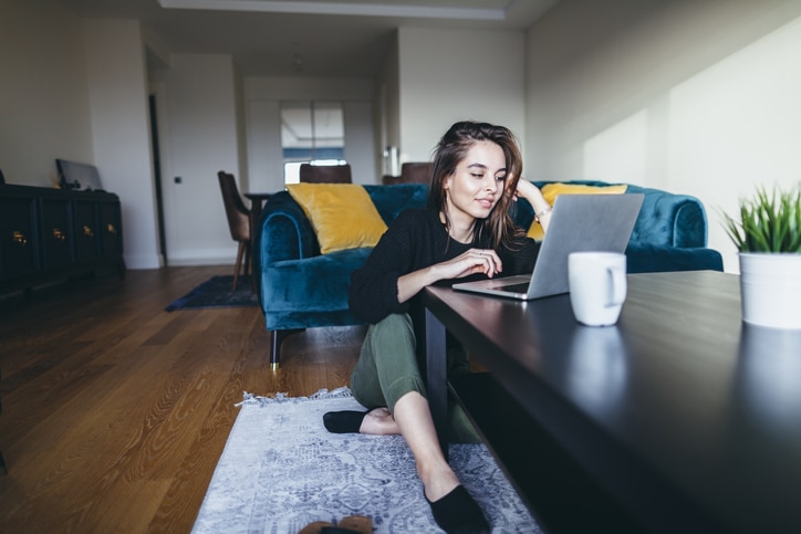 Woman researches psychological degrees on laptop computer