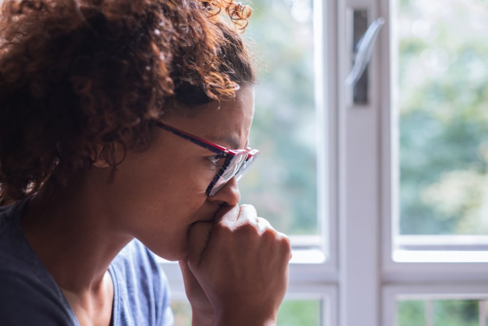 Woman processing negative thoughts and emotions and in need of acceptance and commitment therapy