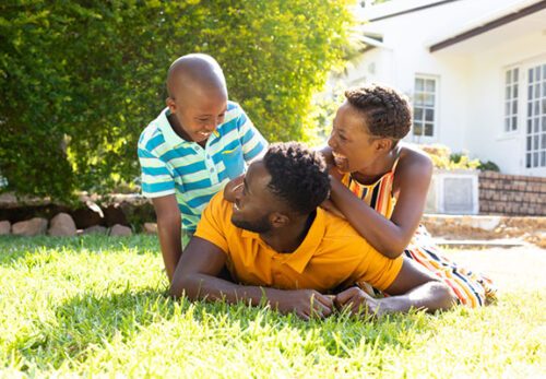 Happy family playing outside
