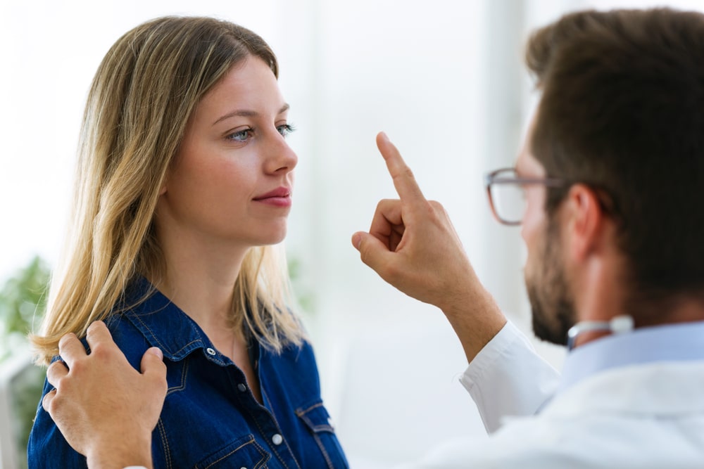 Therapist performing EMDR treatment on woman