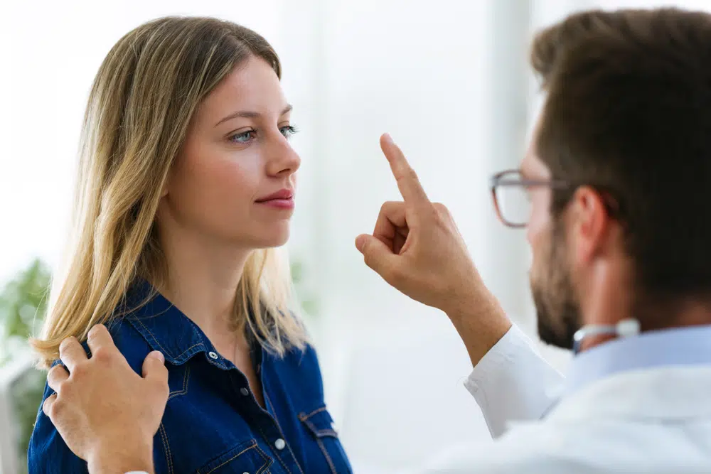 Therapist performing EMDR treatment on woman