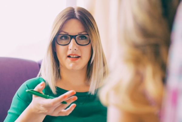 Mental health therapist has individual therapy session with client.