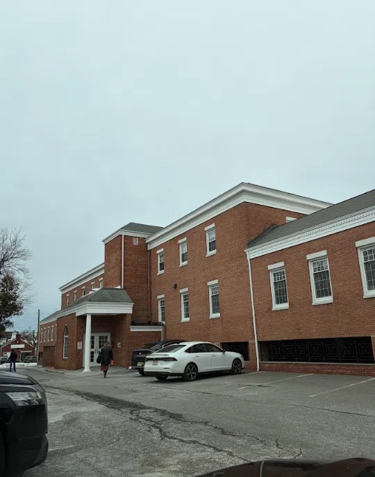 Exterior of the Lukin Center Chatham office, a redbrick building with a covered entrance and parking lot at 97 Main St