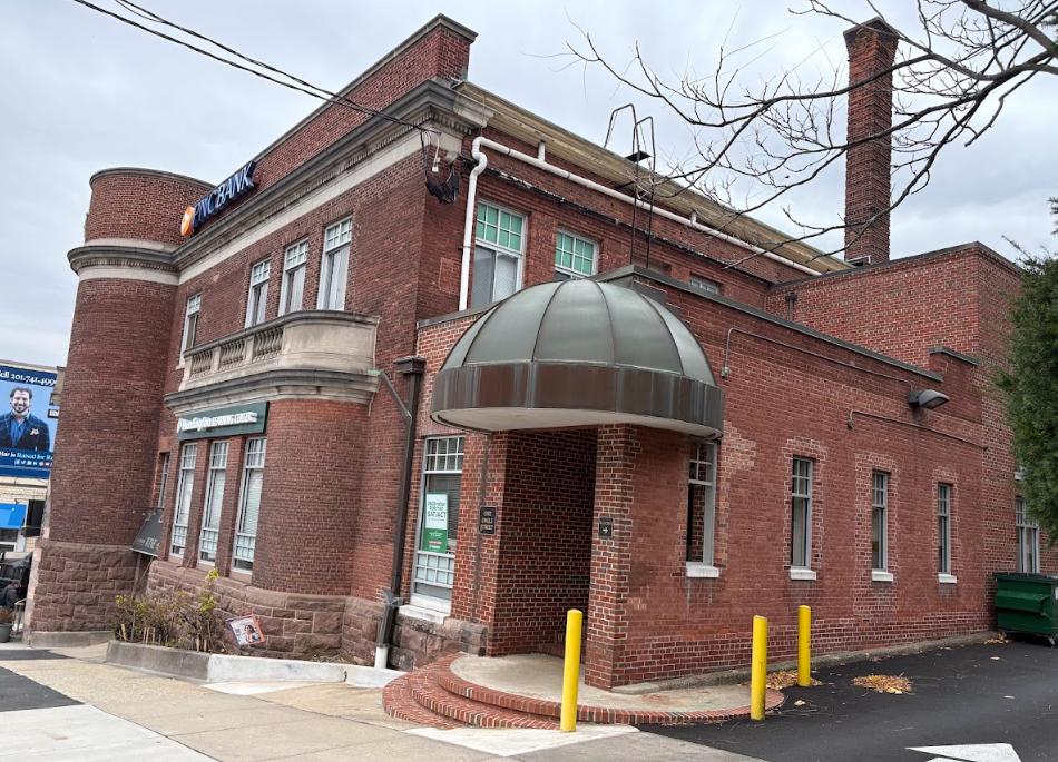 Exterior of the Lukin Center Englewood office, a historic red brick building with a domed entrance canopy at 1 Engle Street