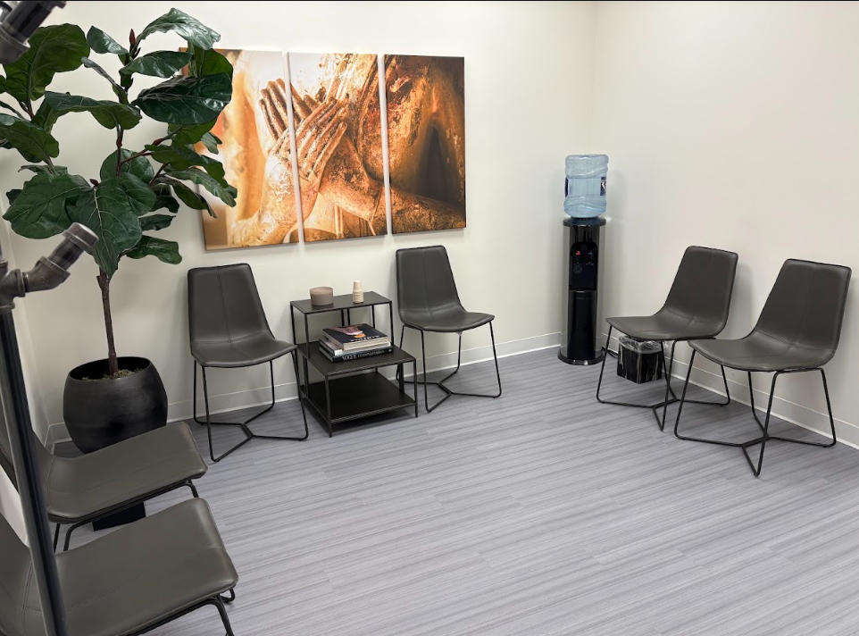 Waiting area with modern gray chairs and framed artwork at the Lukin Center Englewood office