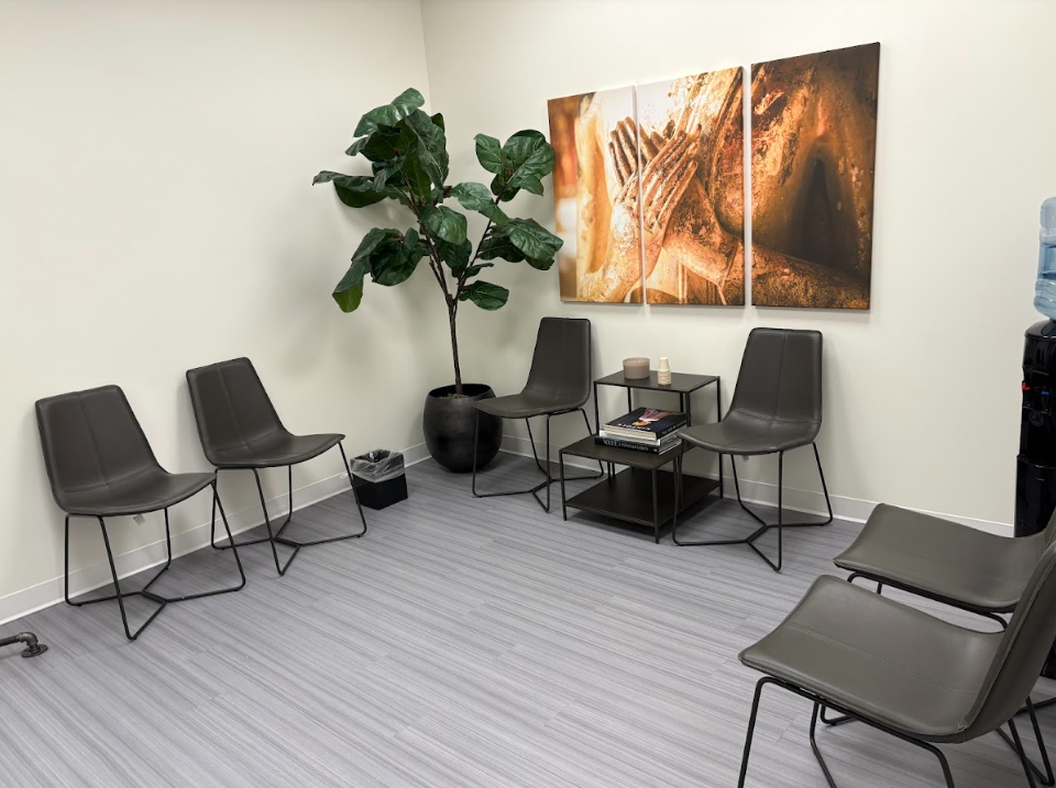 Waiting room seating and wall art at the Lukin Center Englewood office