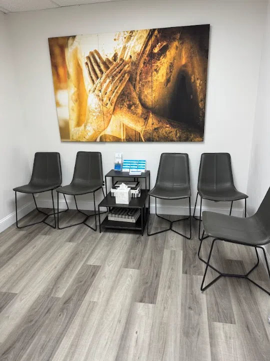 Waiting area with seating and artwork at the Lukin Center Jersey City office