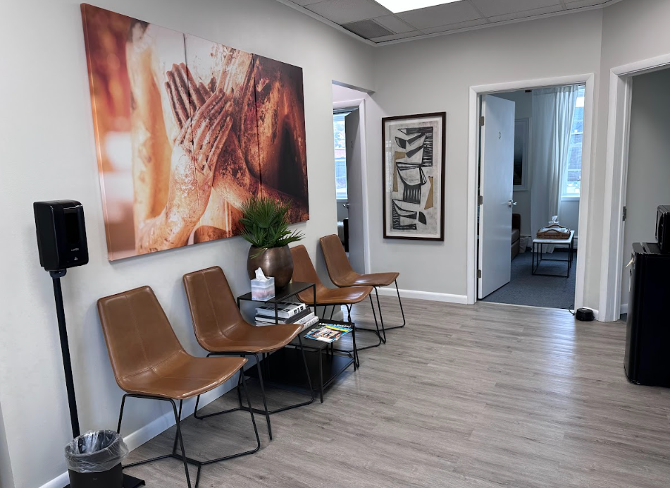 Waiting area with leather seating and artwork at the Lukin Center Montclair office