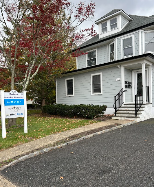 Exterior of the Lukin Center Westfield office at 128 S Euclid Avenue, a gray two story building with signage out front