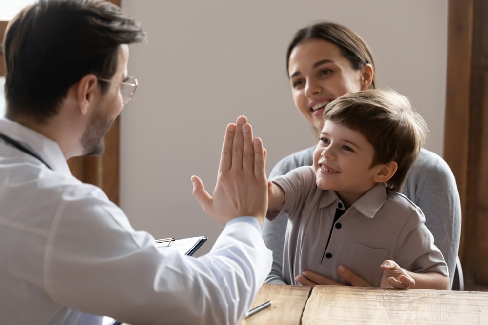 Mother and child use parent child interaction therapy PCIT with mental health therapist