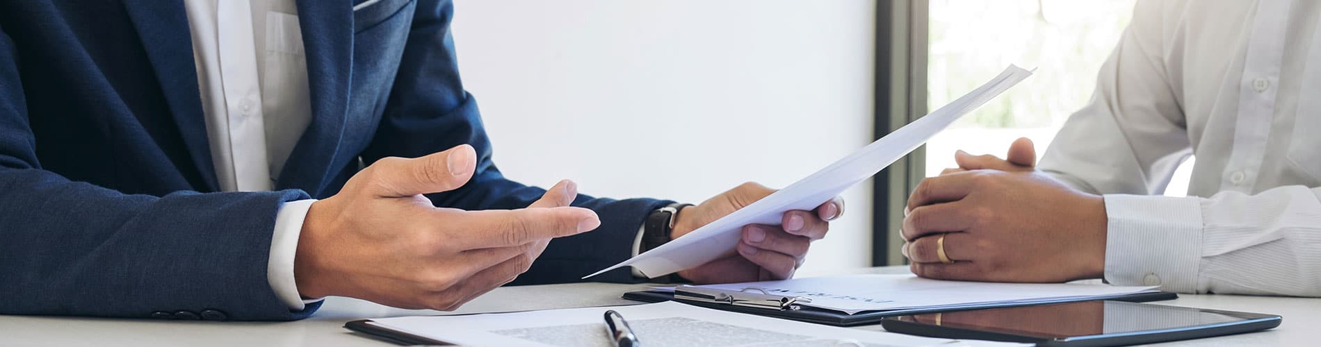 Close up of rates and insurance paperwork on table