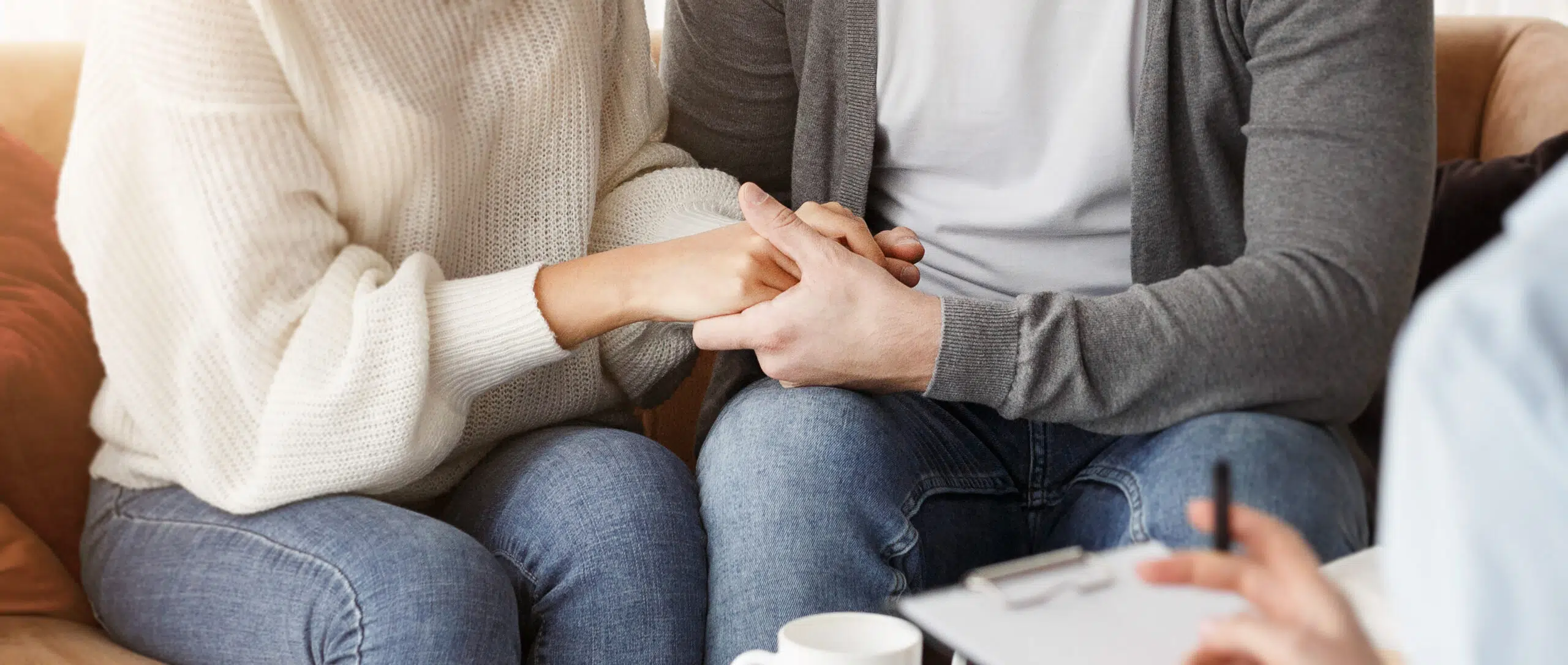 smiling multiethnic spouses holding hands reconcil 2025 03 18 18 03 31 utc scaled