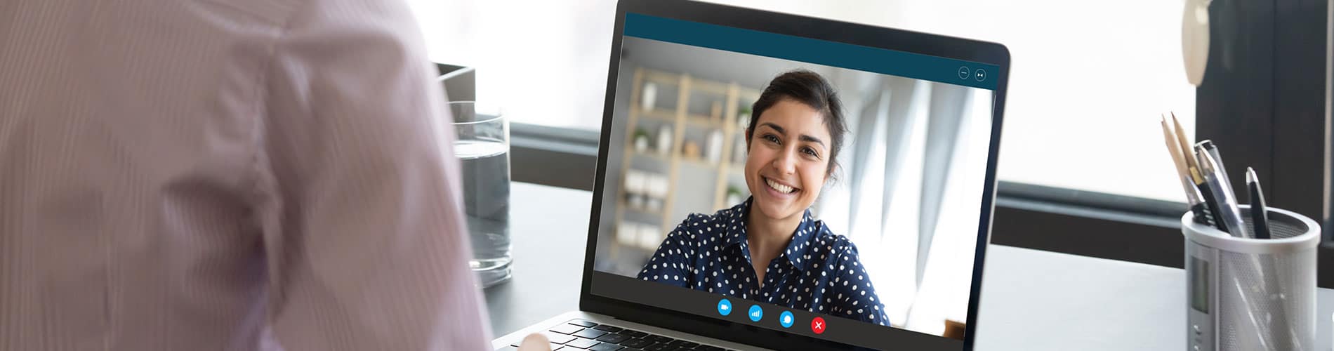 Person receives teletherapy on laptop