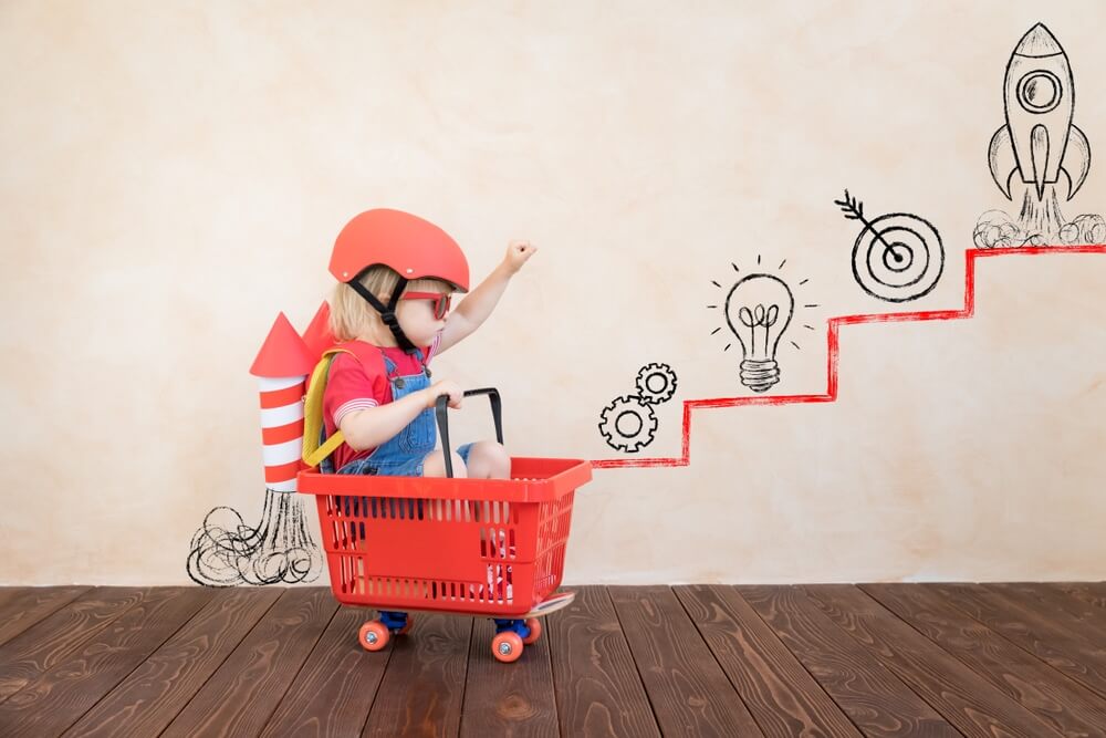 Developing child playing in basket