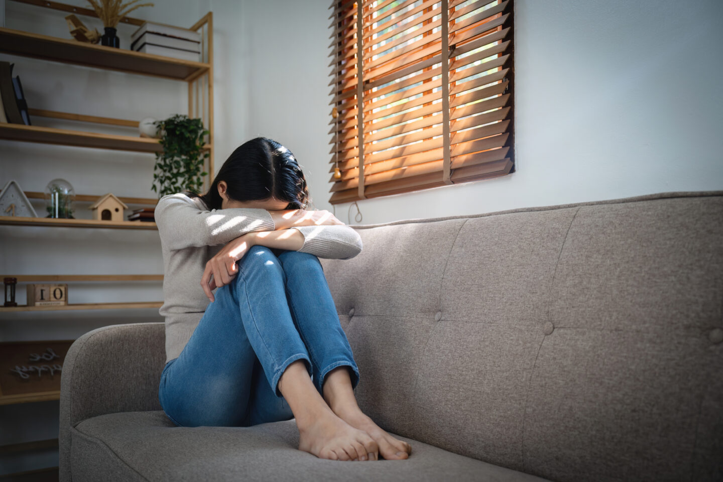 young lonely attractive asian woman crying on couc 2026 01 07 01 26 48 utc